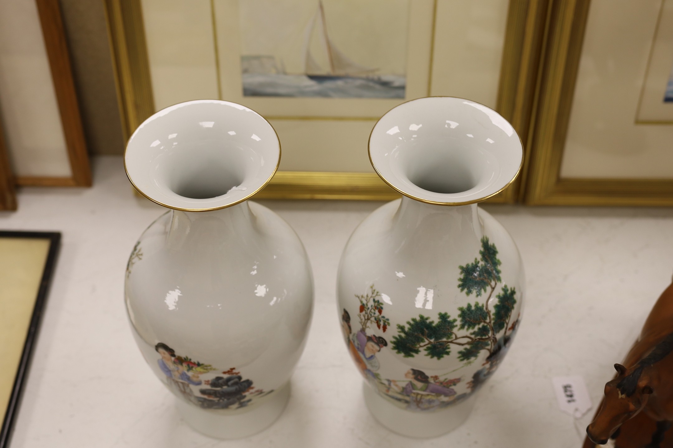 A pair of Chinese famille rose vases, 40 cms high.